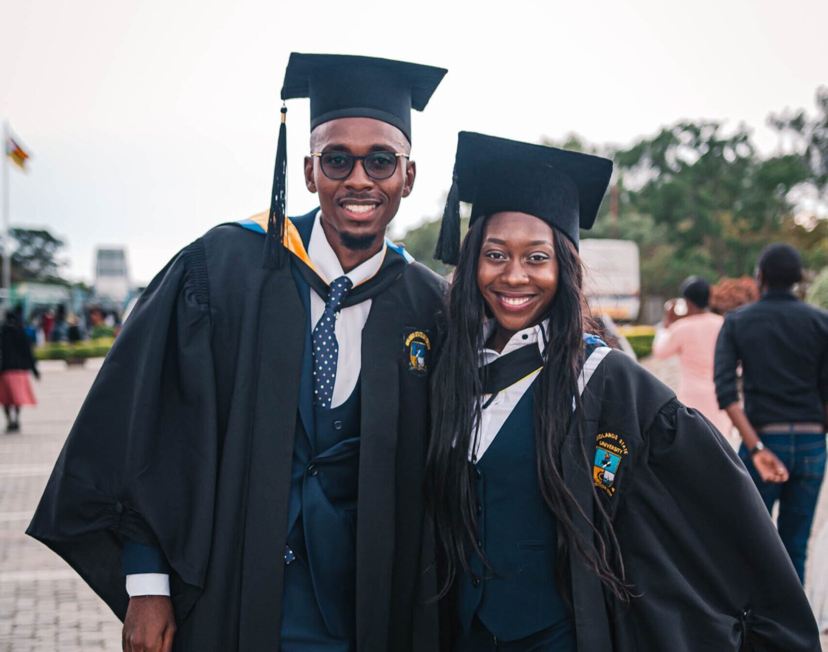 Two students graduating from a college in the caribbean.